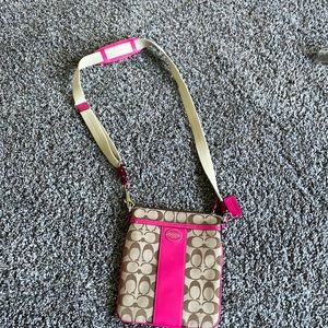 Pink Coach brand crossbody purse